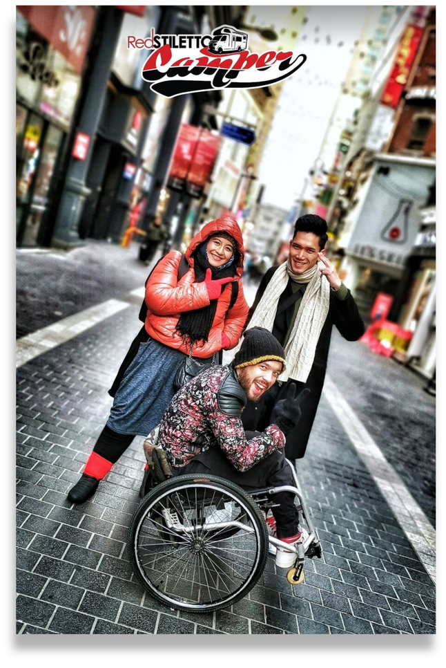 Seoul, South Korea - a person in a wheelchair with two other individuals on the street of Myeongdong night market